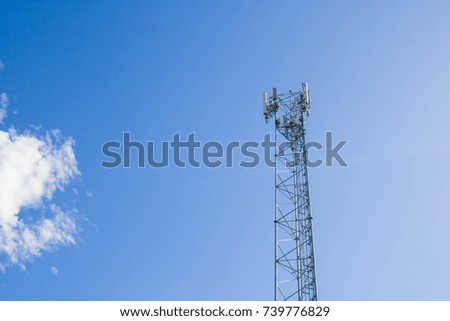 Communications Tower with blue Cloud sky background