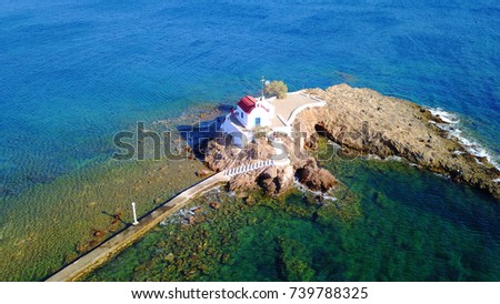 Aerial bird's eye view photo taken by drone of small chapel built in a rock of Agios Isidoros, Leros island, Dodecanese, Greece