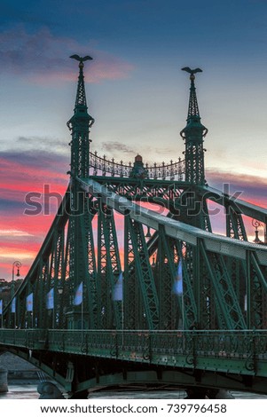 Budapest, Hungary - The beautiful Liberty Bridge at sunset with amazing colorful sky and clouds