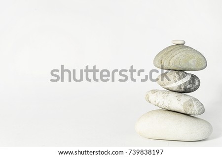 Stones black and white pyramid on white background