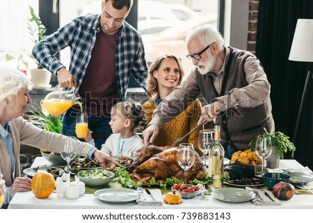 beautiful happy family celebrating thanksgiving day together