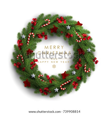 Christmas Wreath Made of Naturalistic Looking Pine Branches Decorated with Red Berries, Wooden Stars and Candy Canes. Royalty-Free Stock Photo #739908814