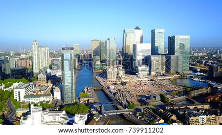 Aerial bird's eye view photo taken by drone of famous Canary Wharf skyscraper complex, Isle of Dogs, London, United Kingdom