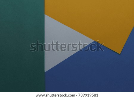 Abstract geometric background with colored paper. Close-up. Top view 