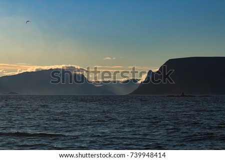 mountains in the morning sun at the coast of Norway close to Andenes in Nordland