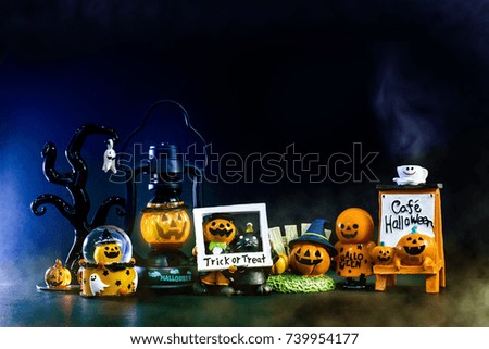 Happy Halloween background toys for kid look cute and funny style presents by pumpkin Jack and kitty cat and friends playing trick or treat stand front of the armchair and the Gothic tree.Copy space