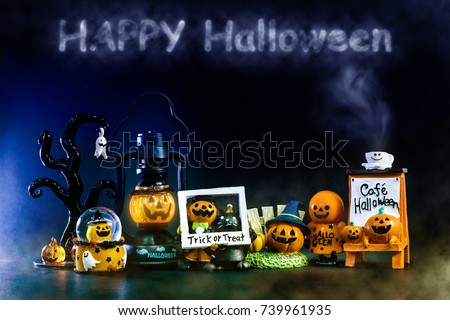 Happy Halloween background toys for kid look cute and funny style presents by pumpkin Jack and kitty cat and friends playing trick or treat stand front of the armchair and the Gothic tree.Copy space.