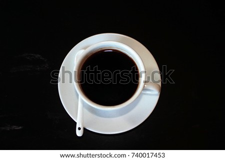 Black coffee on black background