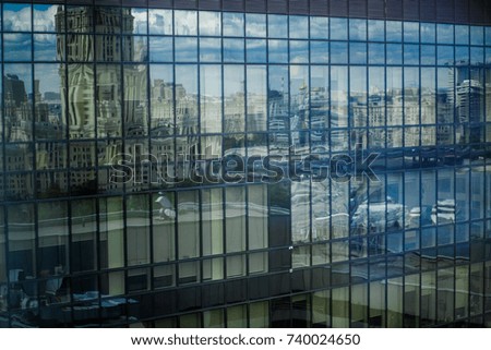 Blurred picture of skyscraper made of blue glass
