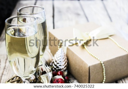 Happy New Year two glasses of champagne close up on a beautiful wooden celebration background.