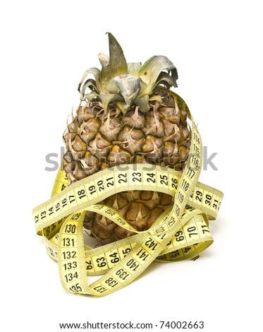 Pineapple with measuring tape isolated over white. Diet concept.