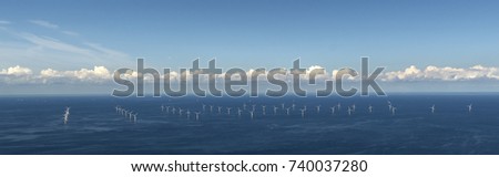 Aerial view of off shore windpark Luchterduinen. The windmills are in the Noordzee, 20 kilometers from the Dutch coastline between Noordwijk and Zandvoort. On the clear horizon a beautiful cloudstreet