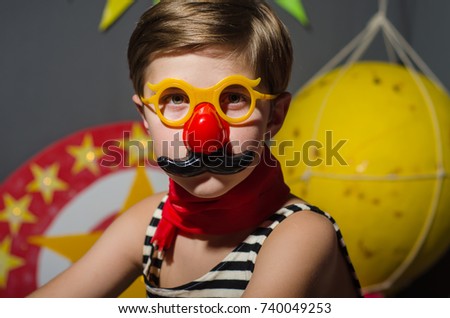 the boy in the costume of a strongman in the circus