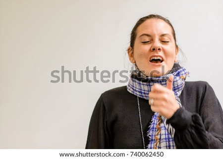 A lady sneezing