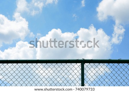 cage metal net front the blue sky