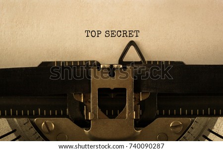 Text TOP SECRET typed on retro typewriter Royalty-Free Stock Photo #740090287
