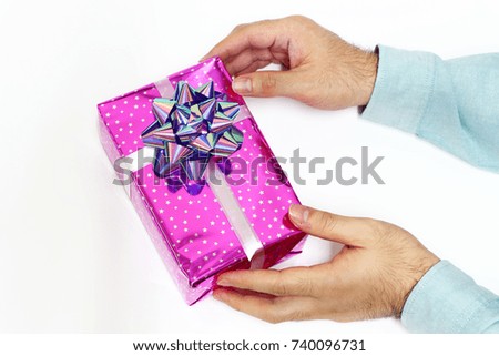 Gift hold on hand with white background.