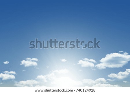 Blue sky background with white clouds and sun rays. Cloudy in daylight