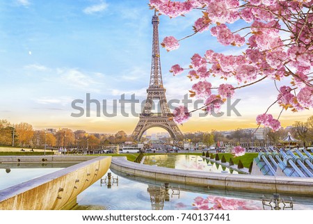 Eiffel Tower in the spring morning in Paris, France. Romantic travel background.