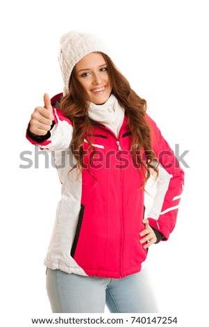woman in pink winter jacket showing thumb up isolated over white background.