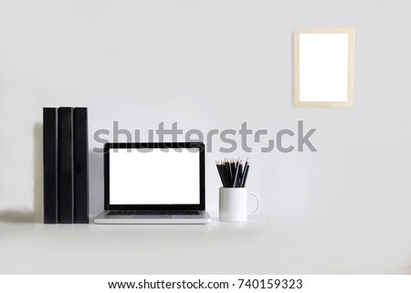 office mockup concept, laptop computer,file document folder,pencil and photo picture flame on office desk with empty screen for photomontage or product display.