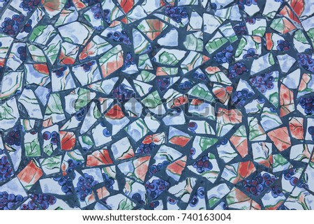 Abstract of colorful cracked mosaic texture as background, background of broken mosaic with drawings of grapes and red leaves