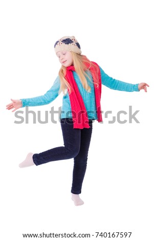 girl with blond hair in winter clothes posing in studio on white background isolate