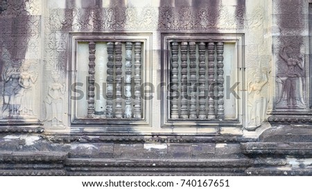 Aspara bas relief and window on the wall of Angkor Wat, Siem Reap, Cambodia