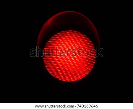 LED Red Light Traffic Light Isolated by a Black Background
