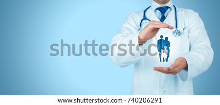Health (medical) and life insurance for the whole family concept. Practitioner doctor with protective gesture and icon of family. Royalty-Free Stock Photo #740206291