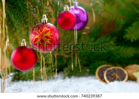 Christmas Fir Tree Branches and decoration with red bauble . Christmas background.
