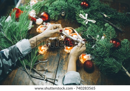 Woman creating Christmas decorations