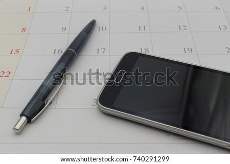 calender date and telephone in business concept with a pen