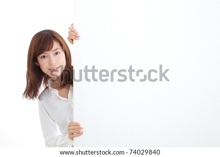 Beautiful businesswoman holding a blank presentation board