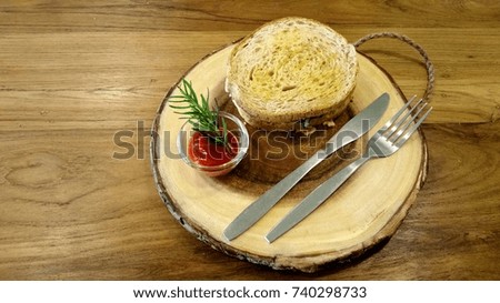 Fresh hamburger on wooden background. Close up of fresh appetizing burger with spinach and cheese.