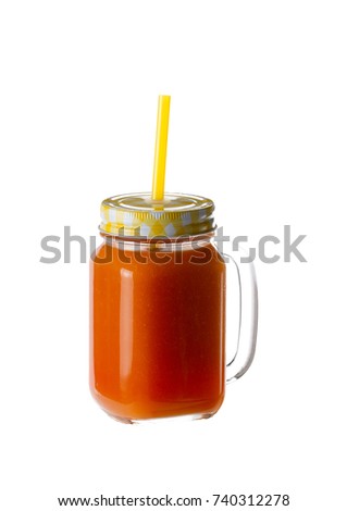 isolate carrot juice in a glass with a lid and a tube