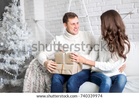 Happy couple. Christmas interior.