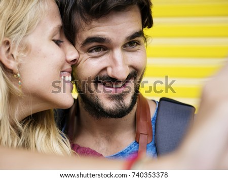Couple taking a sweet mobile selfie