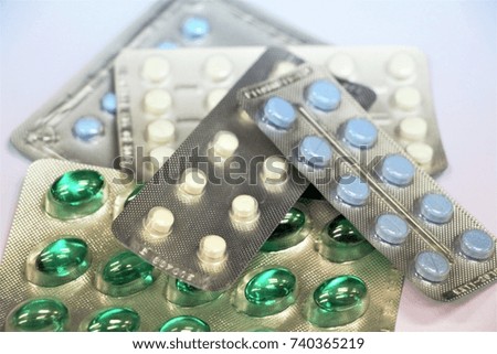 Many packs of medicine and pain killers as prescript on white background. 