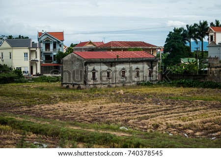 paddy field with vietnamese building in Vietnam