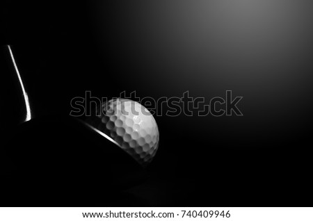 Golf balls and golf clubs to dark