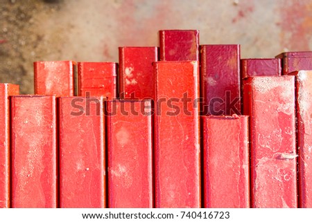 Carbon steel square tubes were paint with red oxide color to prevent them from rusty