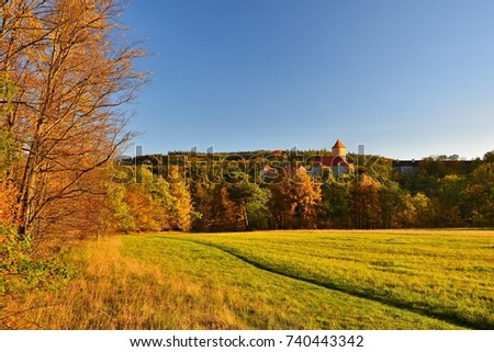 Beautiful Autumn Landscape with Veveri Castle. Natural colorful scenery with sunset. Brno dam, Czech Republic - Europe.