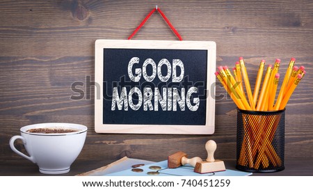 Good morning. Chalkboard on a wooden background