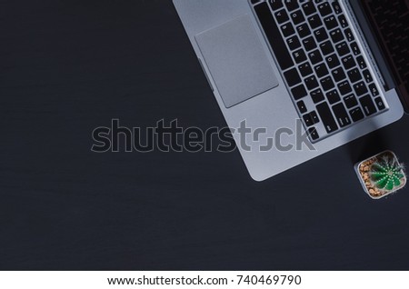 Office stuff and it gadgets display on top view business desk with copy space at text of picture. Creative table, modern project. Business mockup at empty laptop device on wood background.