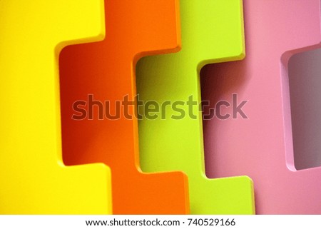 Interior photo of bright multi-colored doors, green, yellow, orange and pink