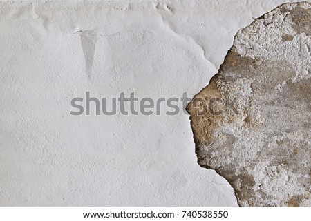 Traces of time on the wall. Old concrete background. Abstract textures.