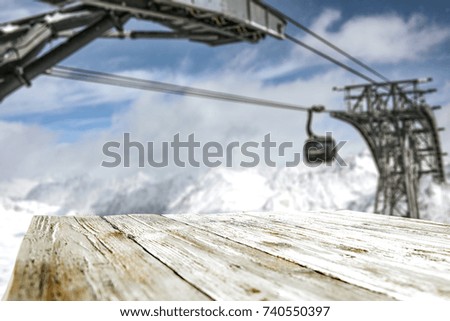 desk of free space and winter landscape of mountains 