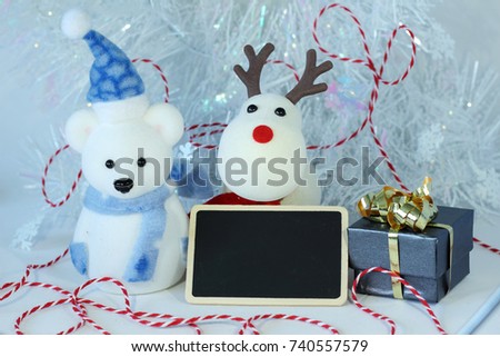 polar bear wearing a hat and a red scarf for Christmas party decoration with a empty message slate
