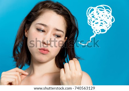 young woman who be troubled by split ends. damaged hair. beauty and hair care concept.